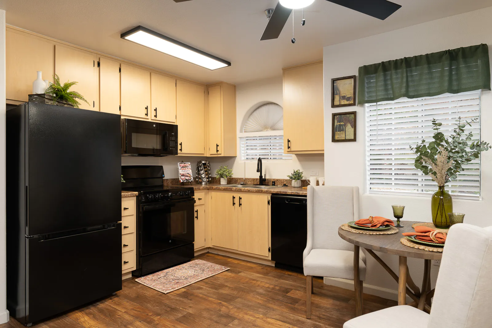 Furnished kitchen and dining area in a Carefree senior apartment home