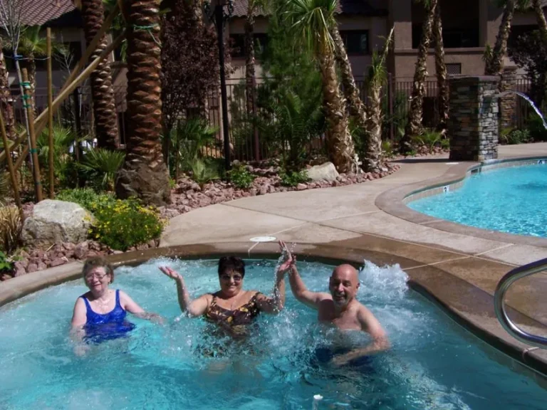 Seniors relaxing at the community pool